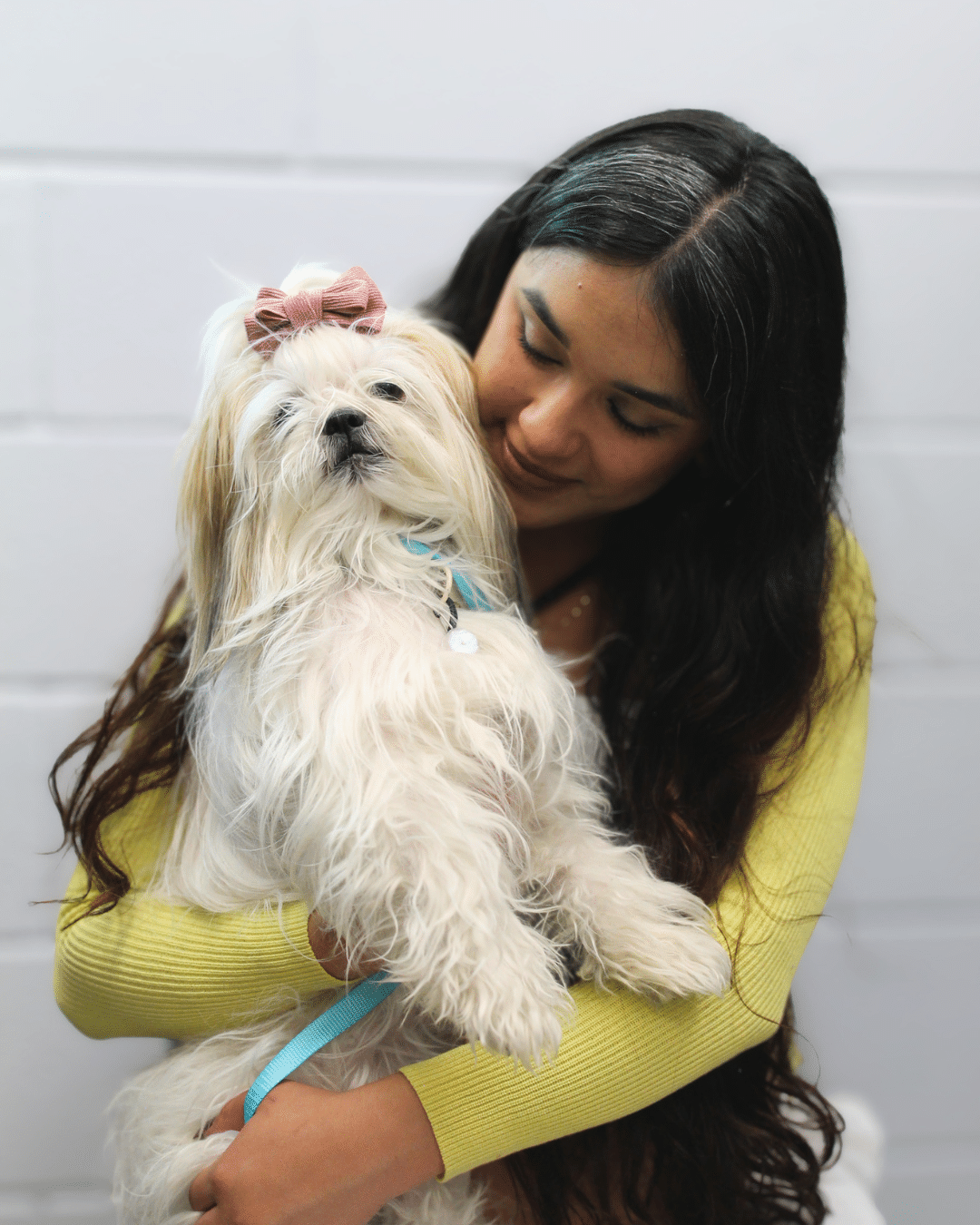 Services - Image of a woman holding a dog