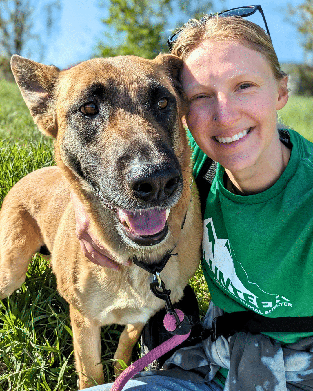 Volunteer - Image of a woman holding a dog